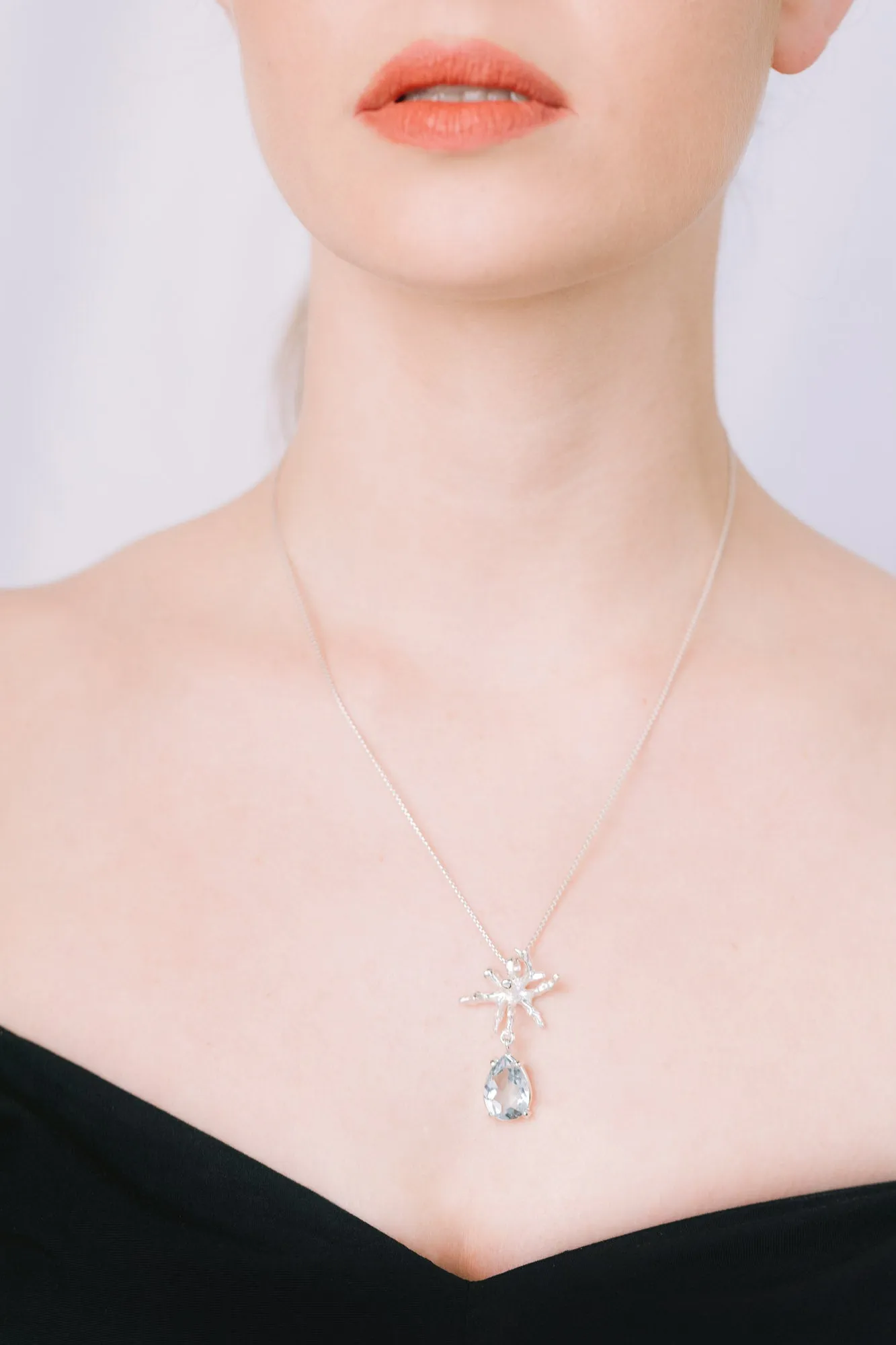 Coral Teardrop Pendant in Blue Topaz
