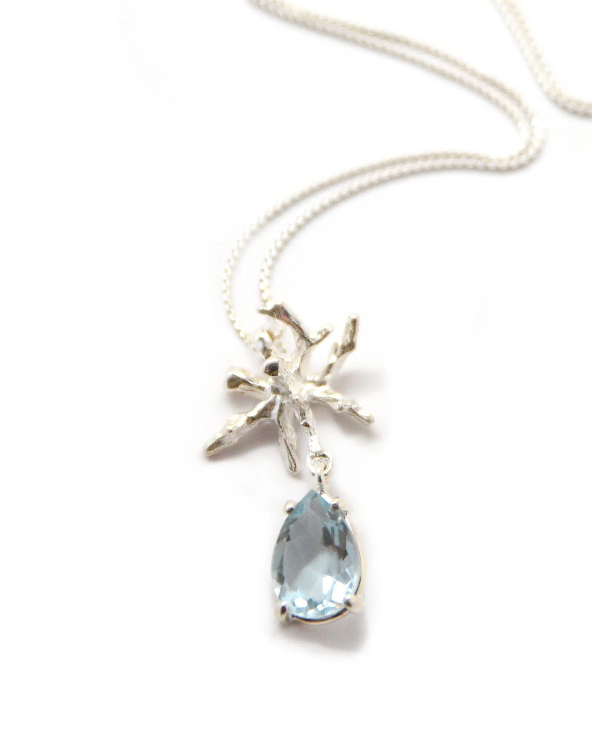Coral Teardrop Pendant in Blue Topaz