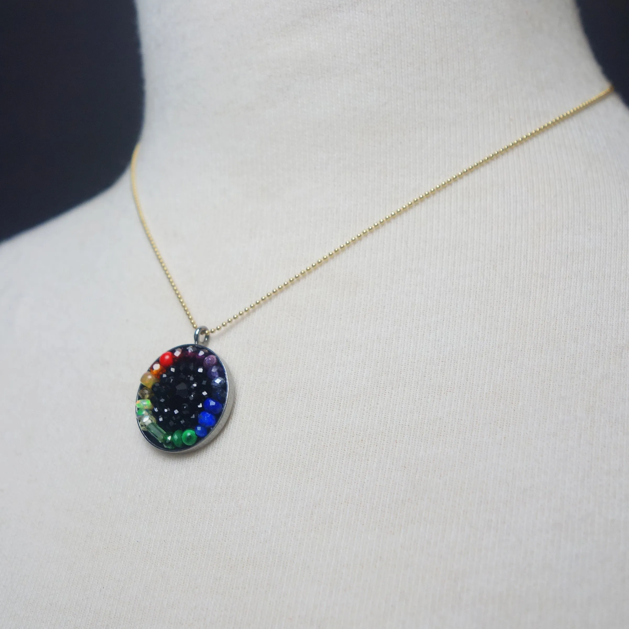 Sapphire, tourmaline, opal: mosaic rainbow pendant on gold