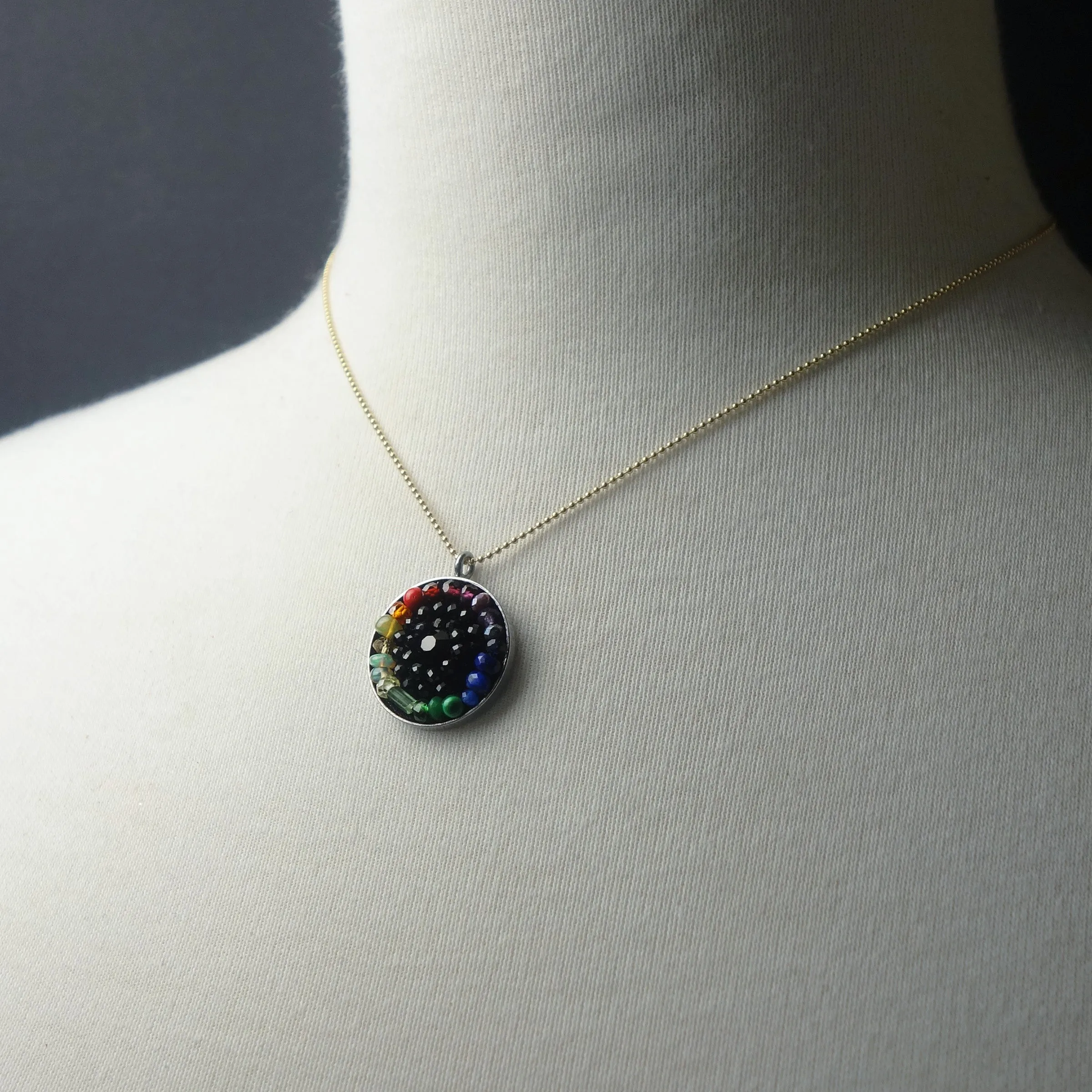 Sapphire, tourmaline, opal: mosaic rainbow pendant on gold