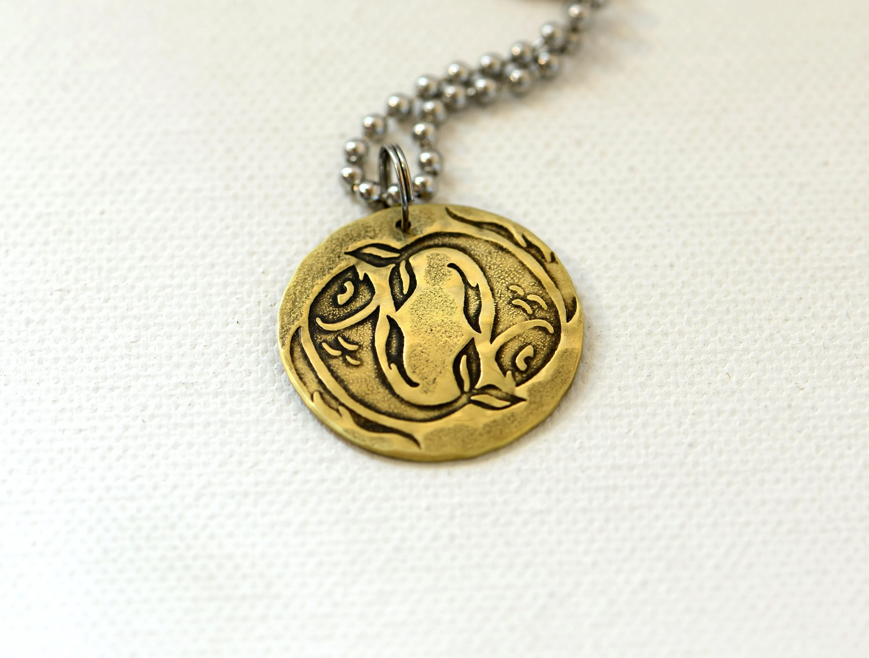 Zodiac charm style necklace shown with Pisces zodiac sign but can be personalized